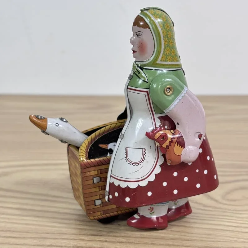 [Lustig] [Neu] Klassische Kollektion Retro Clockwork Wind up Metal Walking Tin Bauerroboter Frau mit der Gans Mechanisches Spielzeuggeschenk