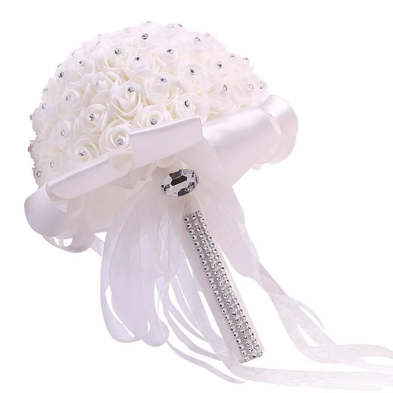 A wedding bouquet of artificial white roses, a bride holding a bridesmaid bouquet of artificial flowers, and a wedding bouquet