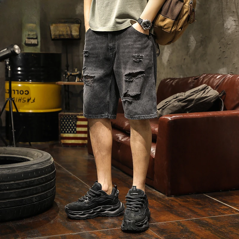 

Summer all-in-one ripped black denim shorts men wear new five-quarter pants thin loose straight leg breeches