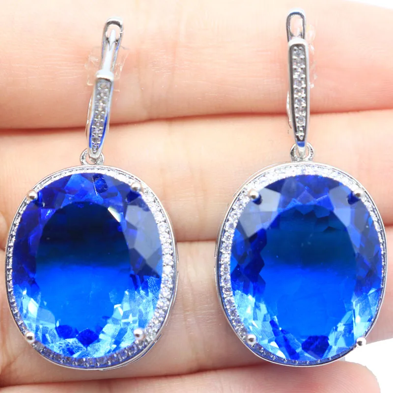 ต่างหูเงินประดับพลอยแทนซาไนต์สีม่วงขนาด 40x21 มม. ตัดละเอียดประณีต น้ำหนัก 17.5 กรัม เหมาะสำหรับผู้หญิง