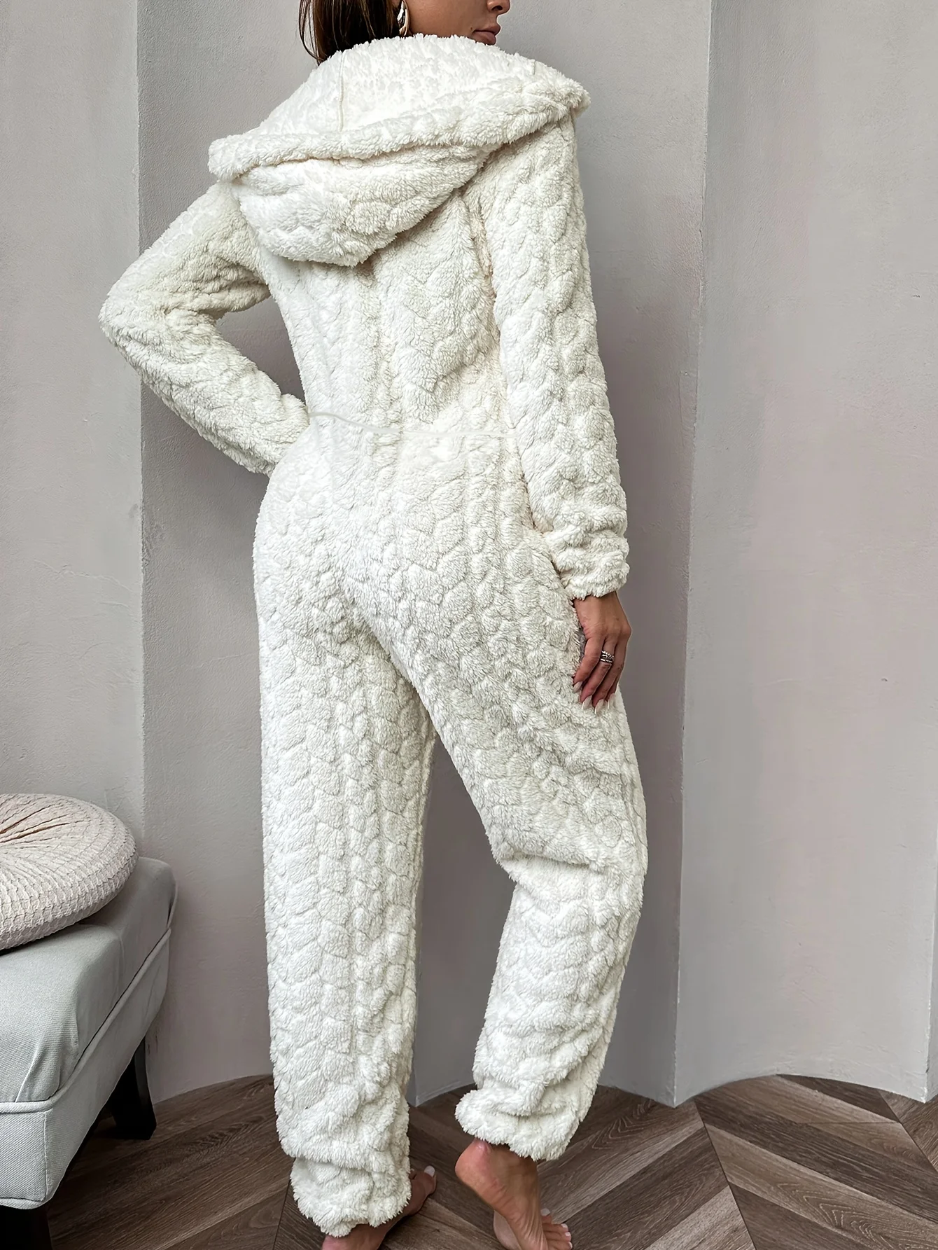 

Cozy Cream Fleece Jumpsuit | Hooded Zip-Up Pajama with Pockets | Soft Polyester for Autumn/Winter Comfort.