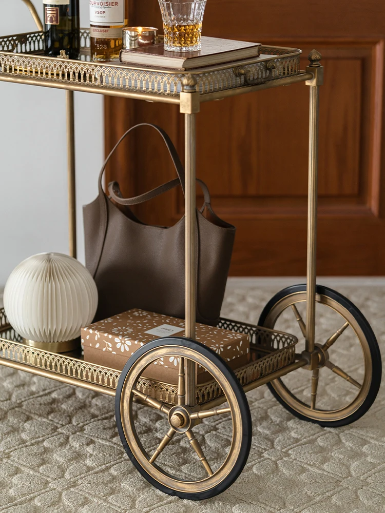 Retro French mobile cart with several metal glass racks for household luxury.