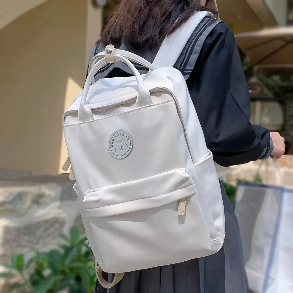 solid-large-capacity-student-backpack-nylon-zipper-academy-girl's-school-bag-multiple-colors-spacious-pendant-teens-rucksack