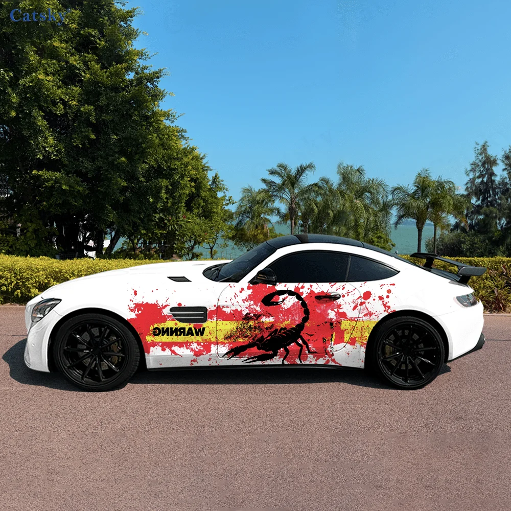 Vinyl wrap for cars and trucks with a poisonous scorpion splashing sticker in front of a yellow warning tape with a bloody handp