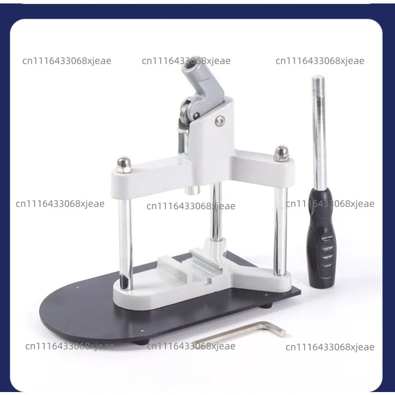 Metal tripod  A machine for making badges