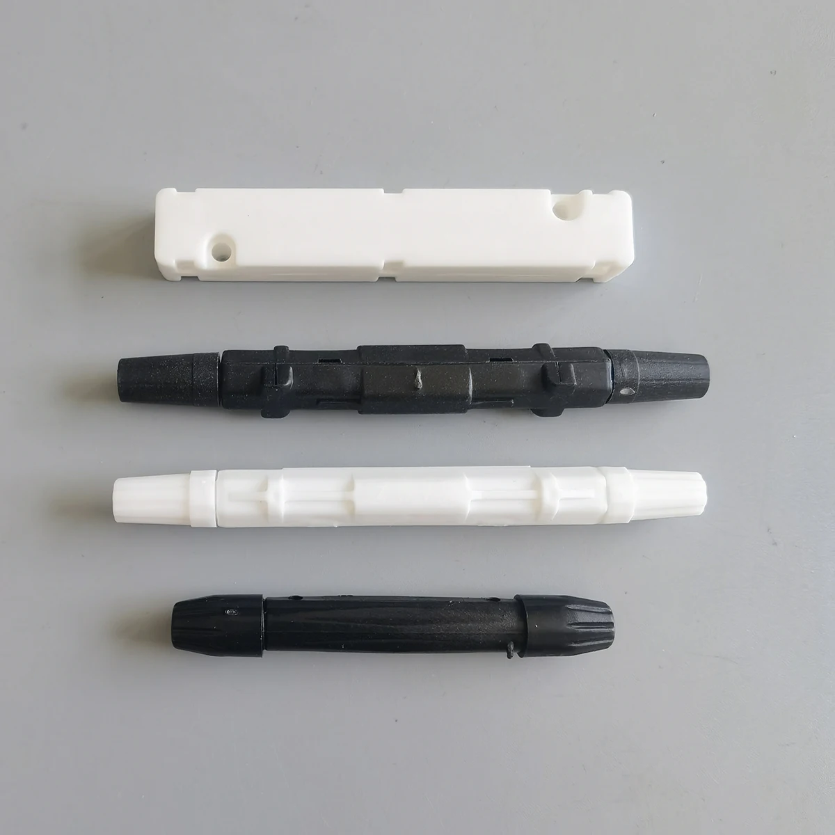 50 Stück/100 Stück Glasfaser-Fusionsschutz, runde Box, schwarz/weiß, für Drop-Kabel, Glasfaser, verschmolzen, rund
