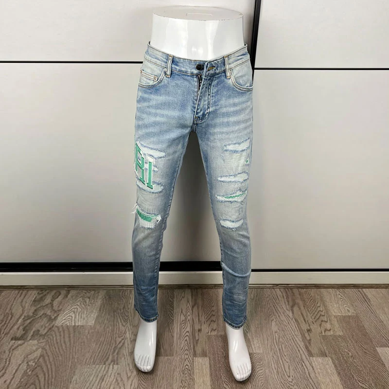 

Designer fashion new men's light blue jeans washed nostalgic stretch slim fit retro perforated green patch jeans high street hip