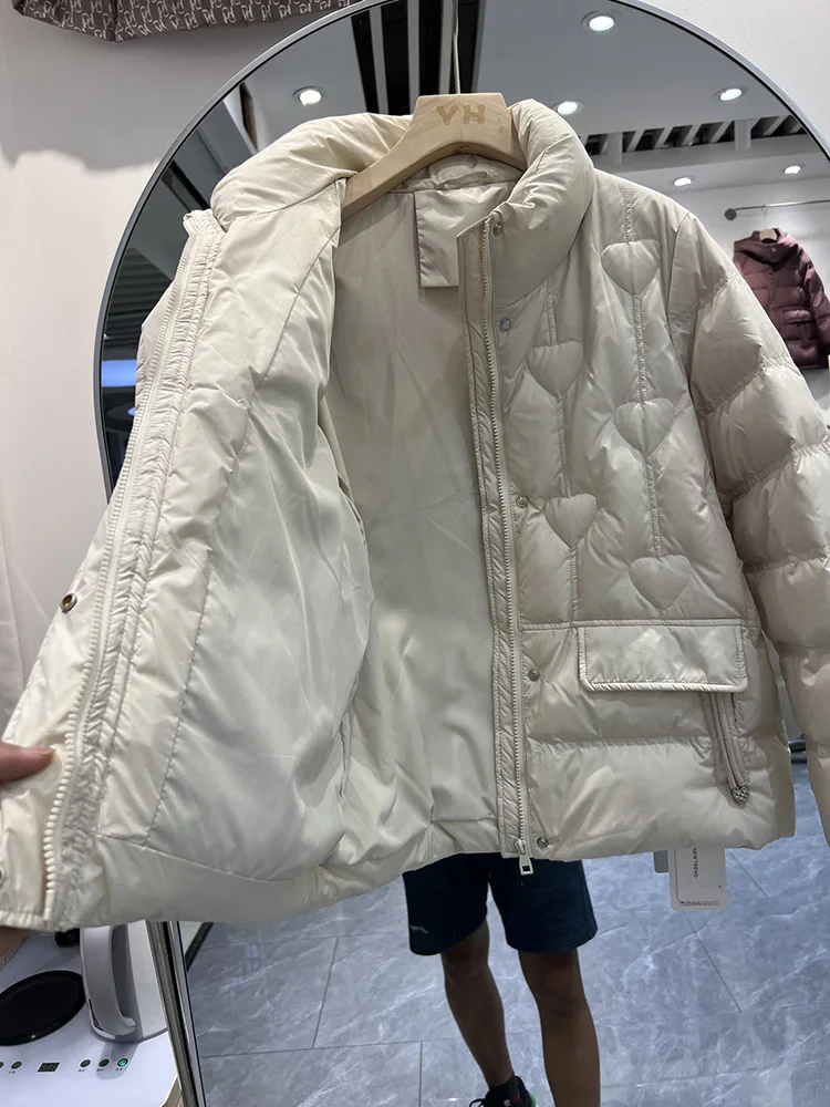 سترة نسائية شتوية جديدة لعام 2025 النسخة الكورية القصيرة بياقة واقفة على شكل قلب سترة كاجوال متعددة الاستخدامات من ريش البط الأبيض