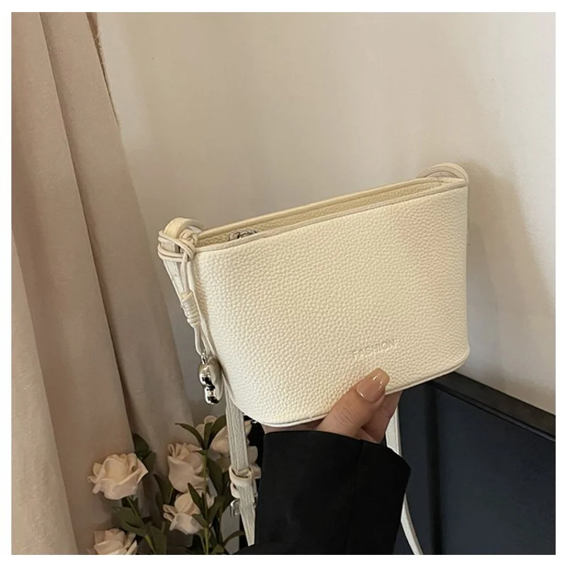 

Leather Tote Bag With Charm For Women With Practical Elegance And A Personalized Touch