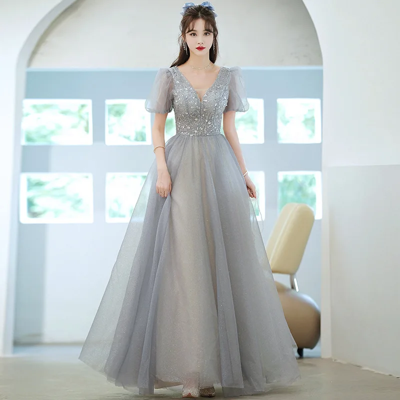 ชุดราตรีคอวีลึกสําหรับผู้หญิงฤดูร้อน 2025 ใหม่Elegant Princessชุดยาวอารมณ์โฮสต์การประชุมประจําปีชุด