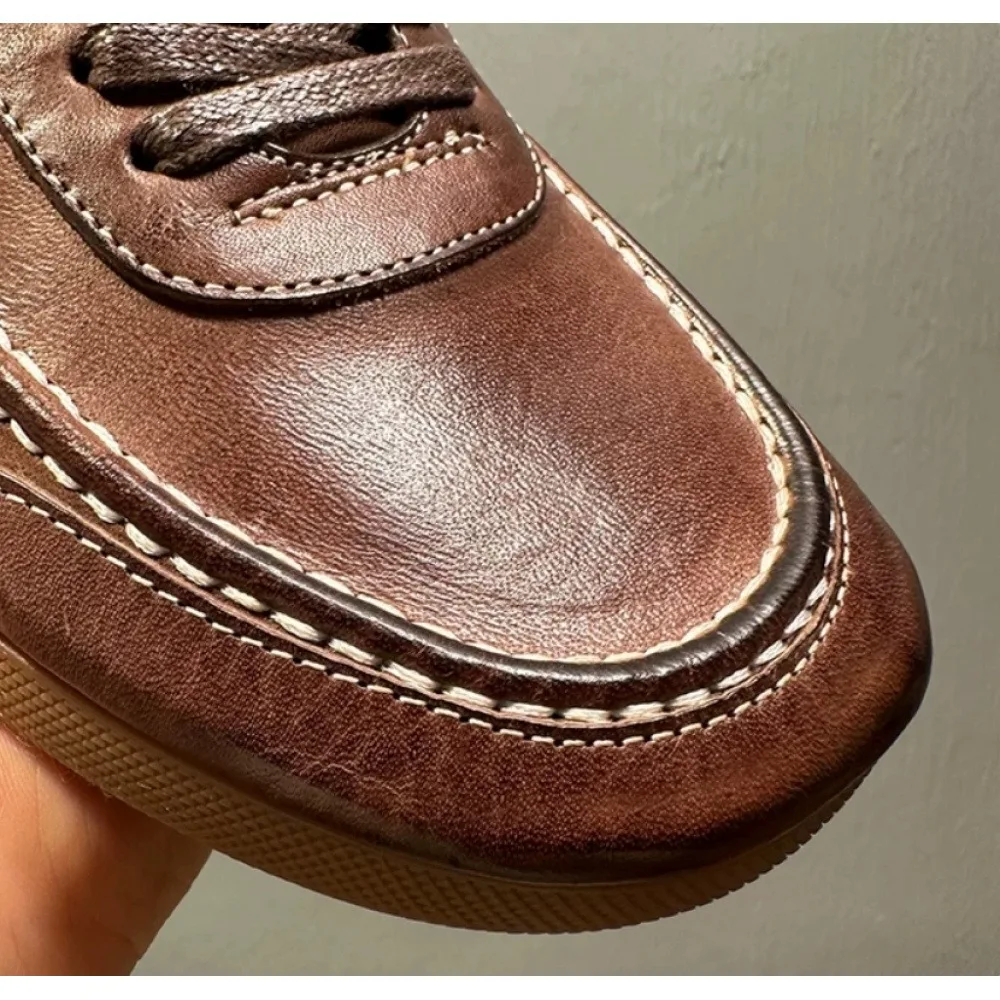 Retro brown leather men's shoes, with soft handcrafted rubber soles and lace-up design for a casual style.