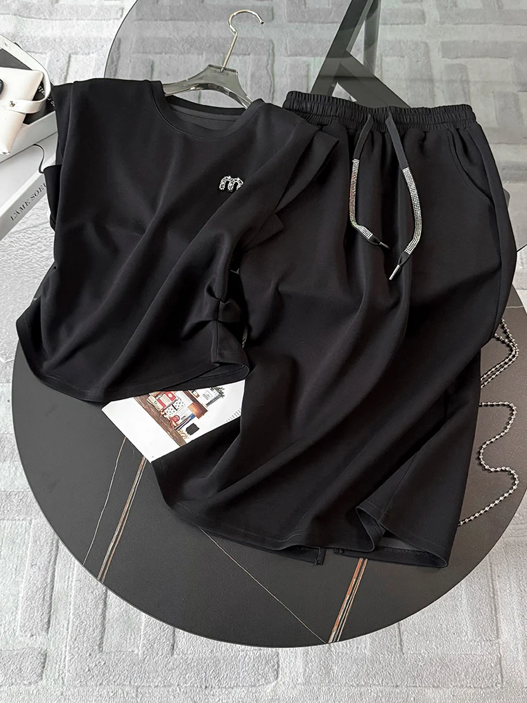 

Hong Kong Style Retro Casual Sports Set Women Summer 2026 New Black Sleeveless Top Half Skirt Slimming Two-Piece Set