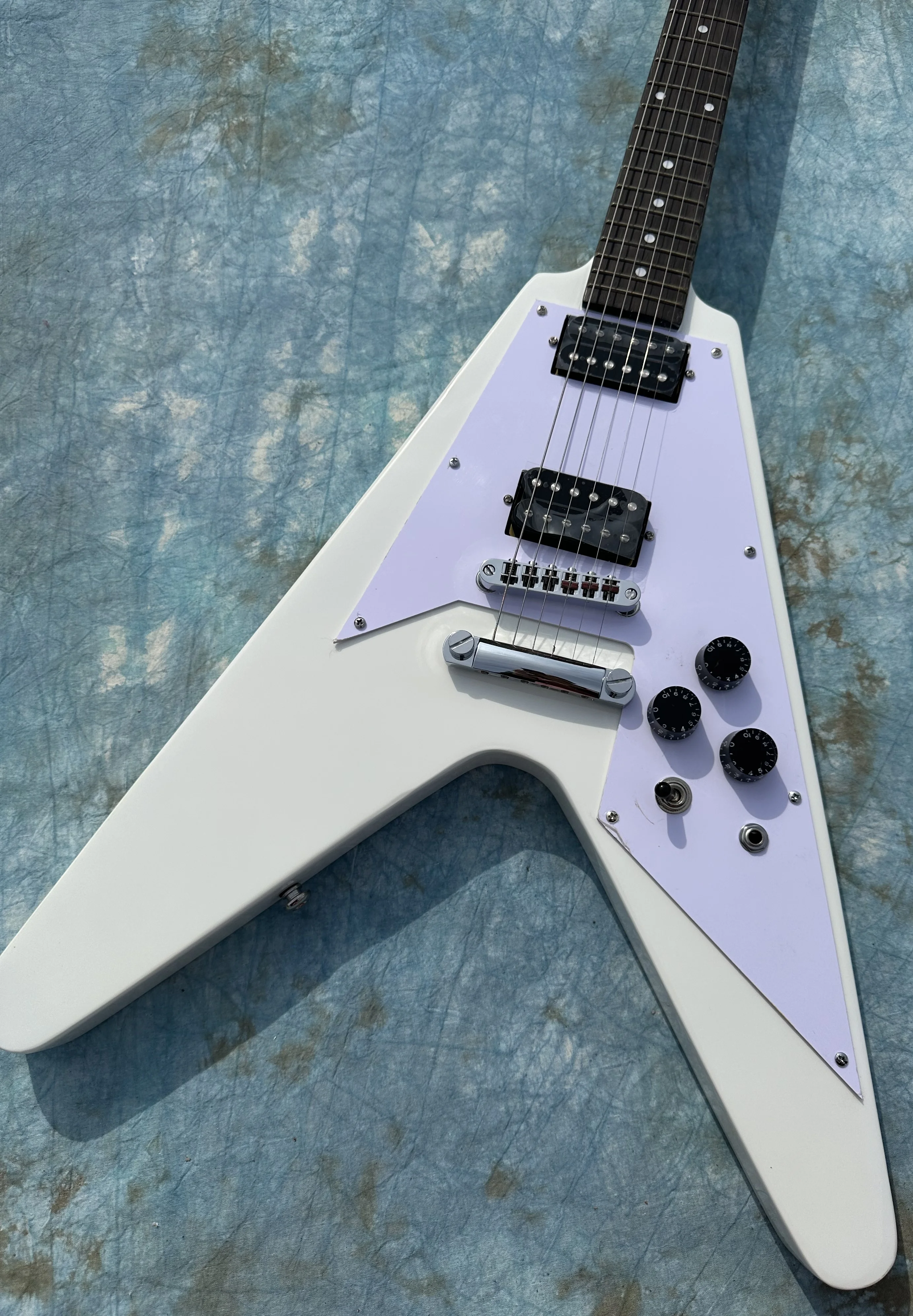 Irregular electric guitar, white flying V, black open pickup, imported wood and paint, shiny, in stock, fast shipping