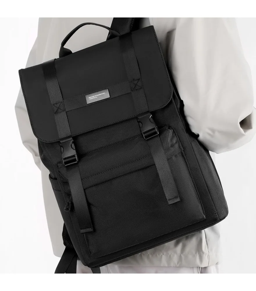 Black workwear style roll top backpack with buckle closure and multiple front pockets water resistant fabric suitable for men