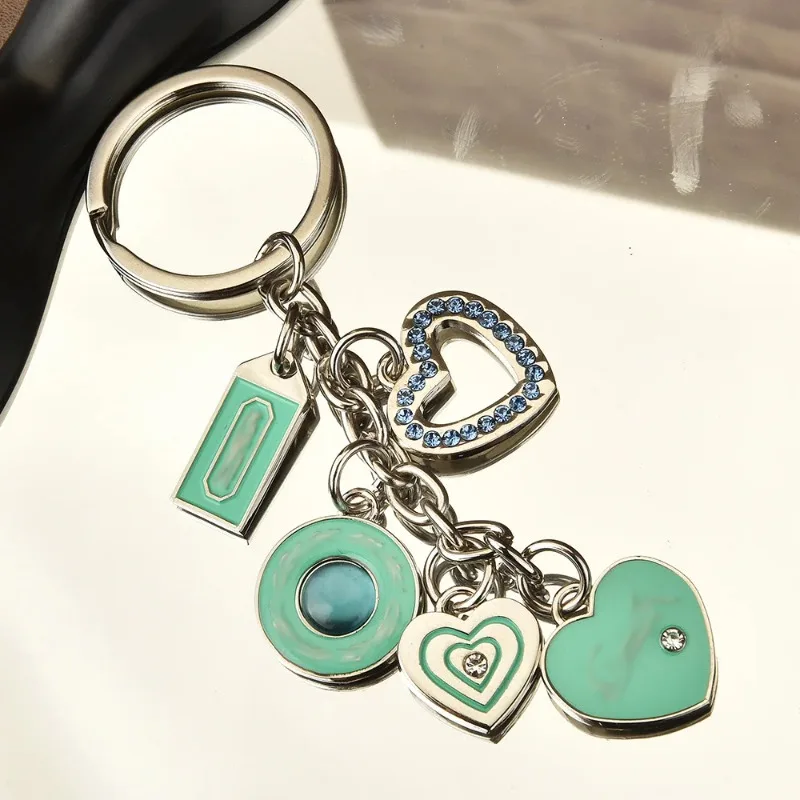 

Exquisite cat's eye heart-shaped keychain pendant, couple metal car keychain, bag pendant