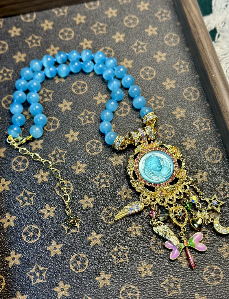 

KF Europe and the United States Fashion Trend Sweet Fresh Blue Cat's Eye Stone Chain Lovely Dynamic Sleep Angel Dragonfly Star T