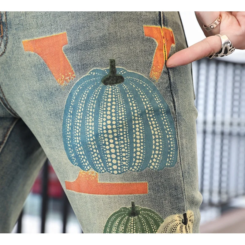Personalized street fashion pumpkin print men's jeans 2024 spring and summer trend retro casual elastic slim tapered pants
