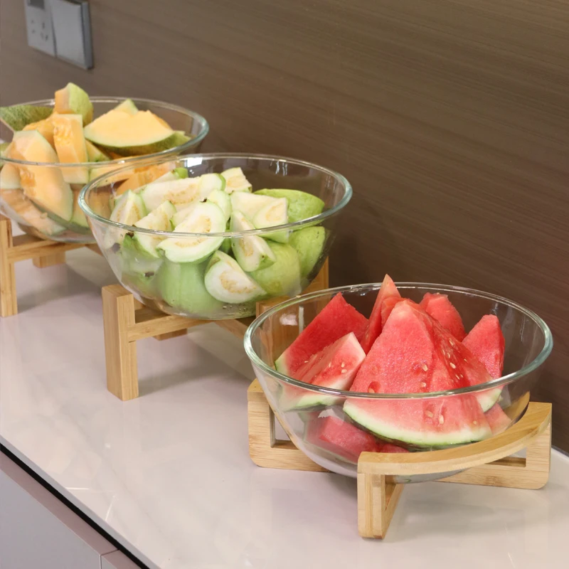 

oversized glass basin, fruit bowl, bamboo wooden frame, tall buffet, cold dish display plate, commercial utensils.