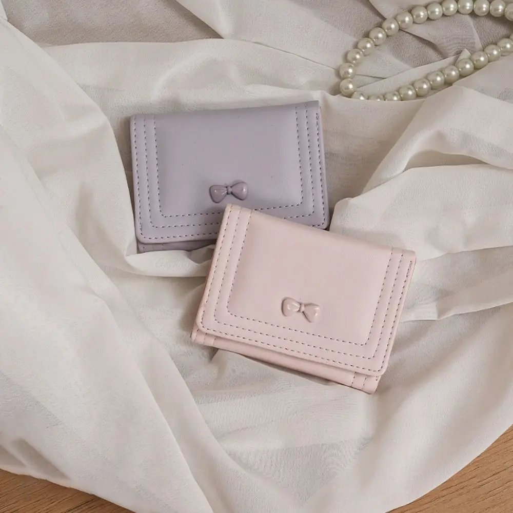 Portafoglio corto con fiocco alla moda Portamonete in pelle tinta unita in pelle PU Mini porta carte d'identità di grande capacità per donna