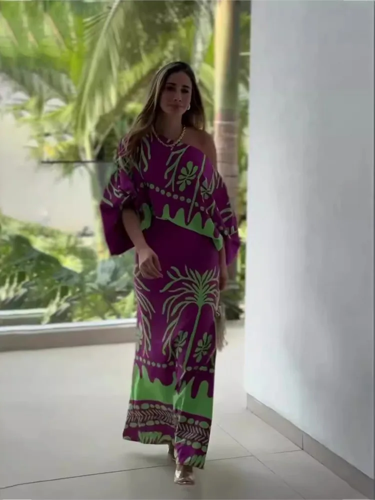 セクシーな女性用プリントツーピースセット 2026年春新作 オフショルダーシャツ ハイウエストロングスカートセット レディース服