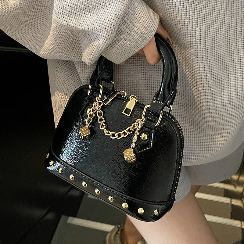 

2026 Hot Sale Light Luxury Temperament Rivet Trendy Cool Style Handheld Shell Bag Fashionable Versatile Niche Crossbody Bags