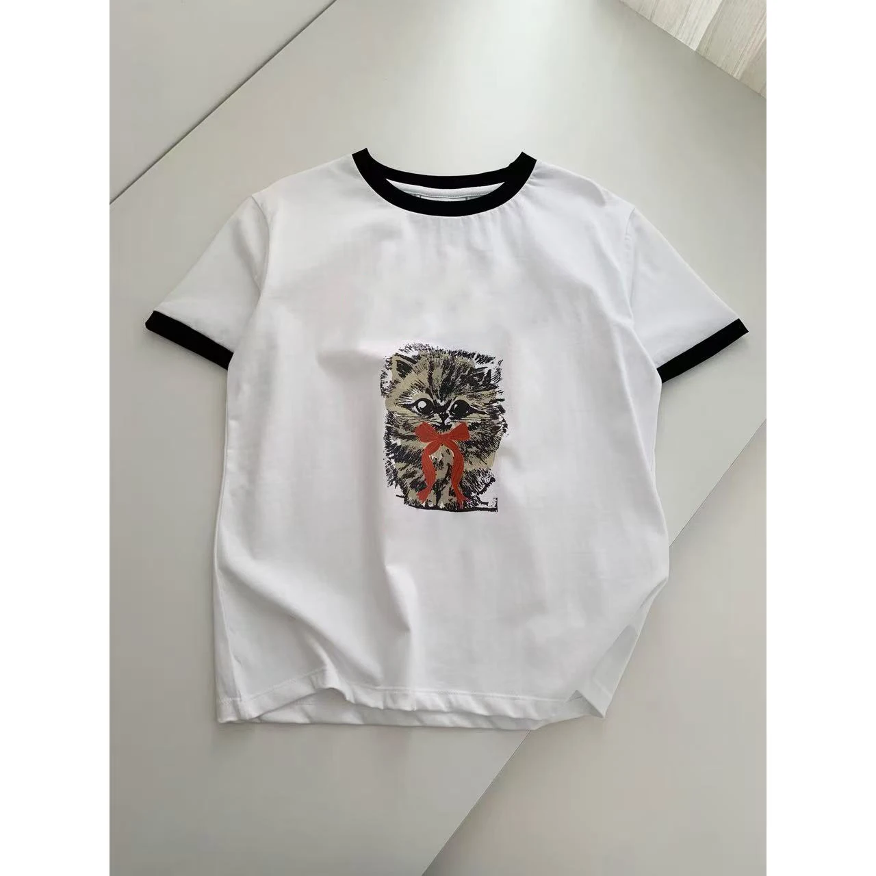 KAILE Early Spring 2026 Women's Knot Print ort Sve T-irt oulder Width Stand Casual Sle round Ne