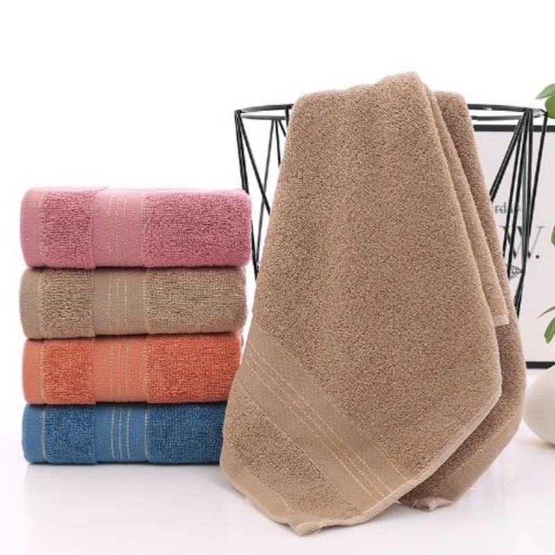 Plain cotton towels with gold edge, soft and absorbent, family pack of 4 pieces