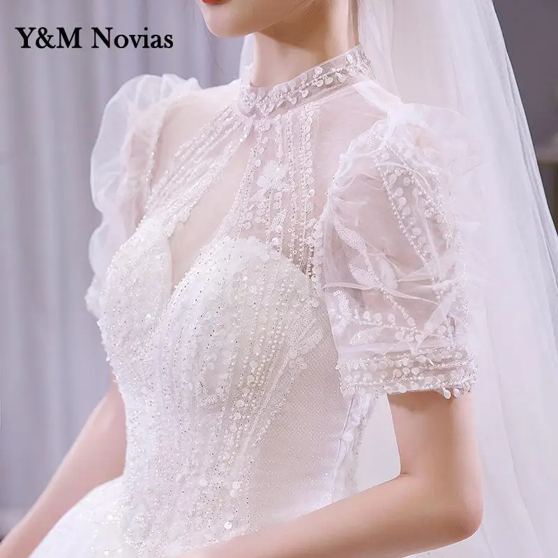 Y & M Novias Nieuwe Licht Trouwjurk Bladerdeeg Mouw Hoge Hals Luxe Kant Applicaties Bead Lovertjes Droom Bruid Gown plus Size Illusion