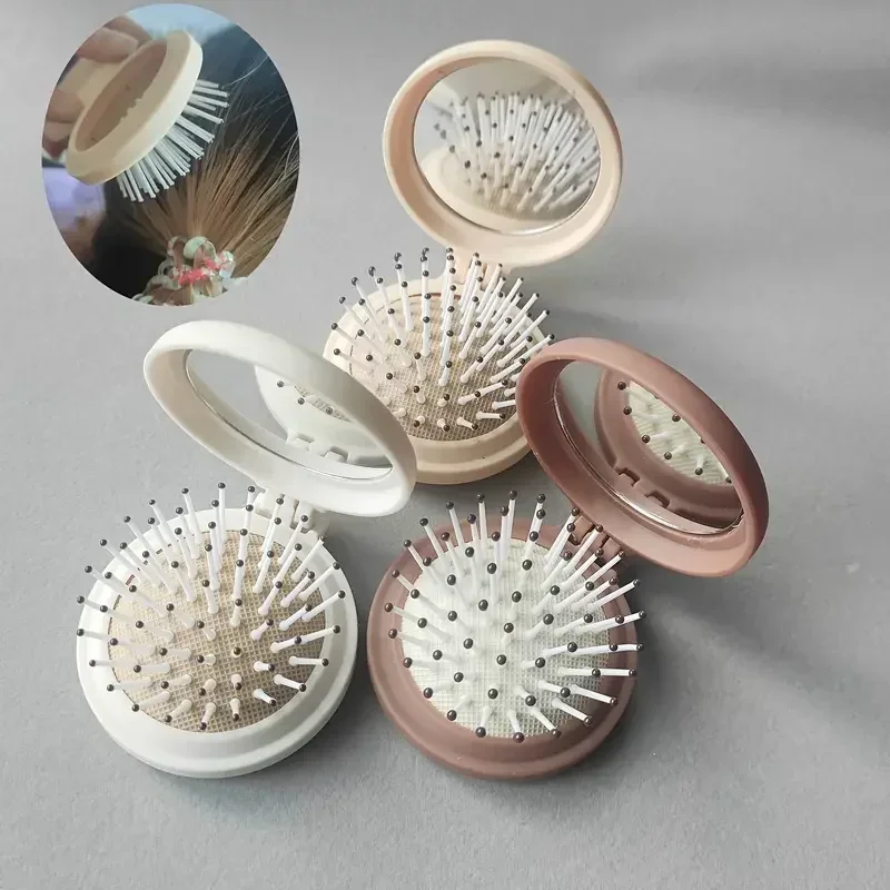 

1pc Portable Folding Makeup Mirror with Air Cushion Massage Comb - Multifunctional and Convenient for Travel and Outdoor Use