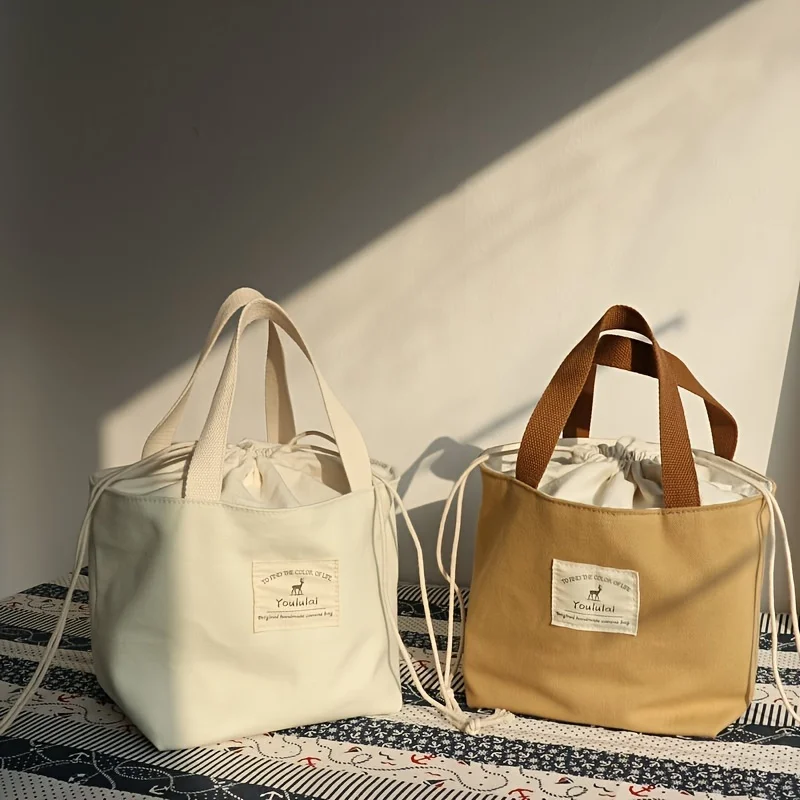 Simple solid color Japanese-style and breezy lunch bag, convenient portable canvas bag with thick lunch box bag lunch bag.