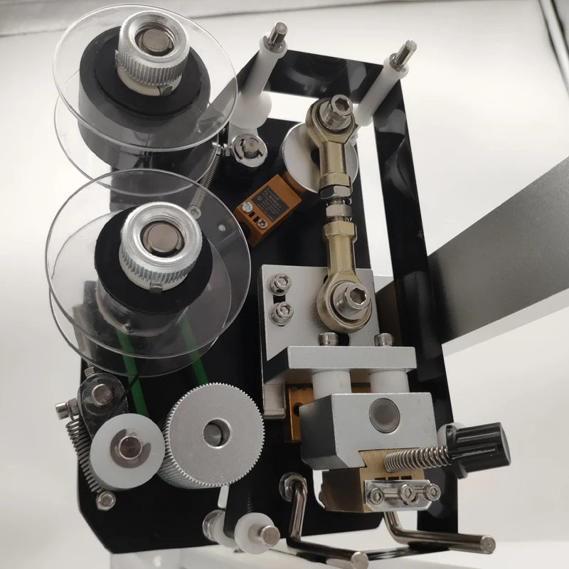 The automatic hot stamping and coding machine HP241 prints expiration dates, serial numbers, and batch numbers