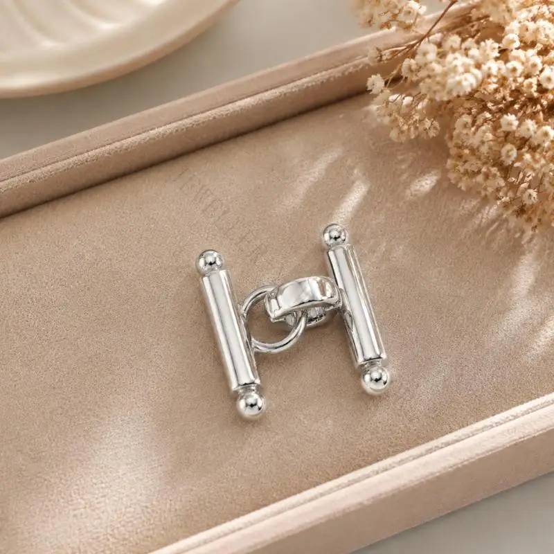 R7UF Jewelry Making Connector with a Defined Central Attachment Point