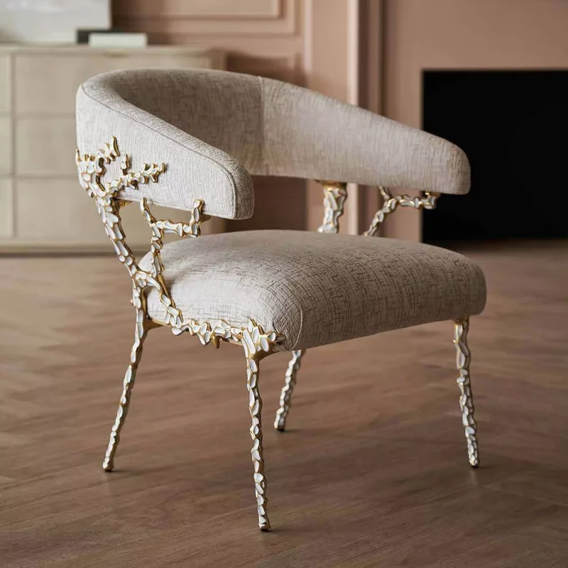 Luxury contemporary dining chair with detachable brass finish and velvet upholstery for a home office