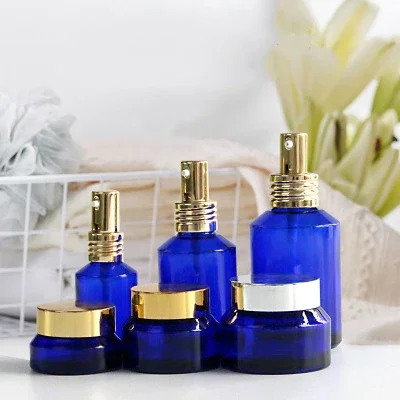 Popular, recargable, forma redonda, embalaje cosmético para el cuidado de la piel, tarros cosméticos de vidrio de color mate transparente y juego de botellas de maquillaje