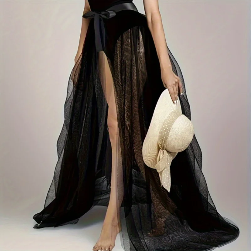 Zwarte semi-transparante mesh-verfraaide rok met striktailleversiering, sexy en sfeervolle midi-rok voor dating- en feeststyling.