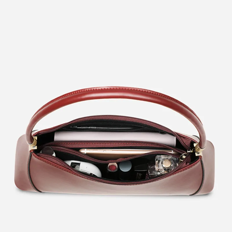 Tas Tangan Kulit Asli Retro Fashion Tahun Baru dan Musim Panas 2025 Wanita Multifungsi Pakaian Solid Gaya Korea Bantalan Stik Kopling B