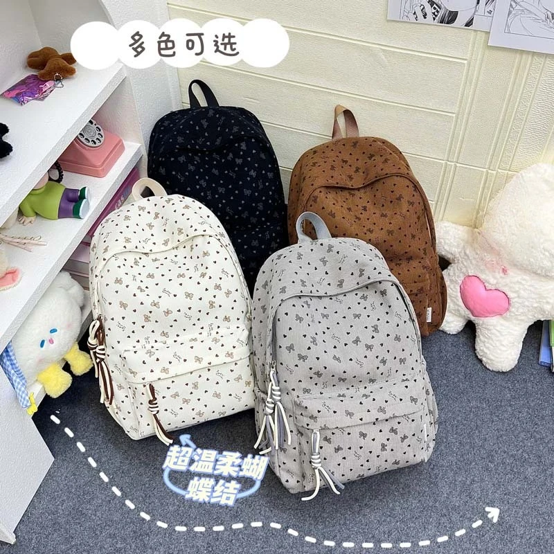 Thick-woven corduroy student schoolbag with large capacity, cute bow design, suitable for women, lightweight travel backpack
