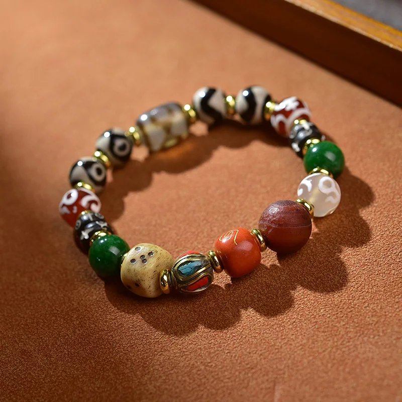 

Tibetan-style -bead Dzi bracelet with multiple totems multi-eye designs symbolizing fortune and wealth,