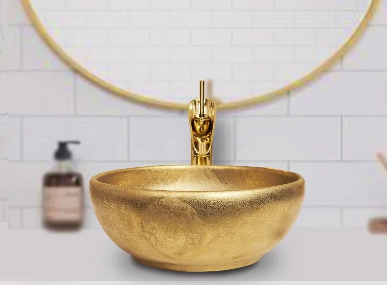 Gold plated ceramic basin on the table, hand basin, circular hotel, light luxury, Nordic minimalist art