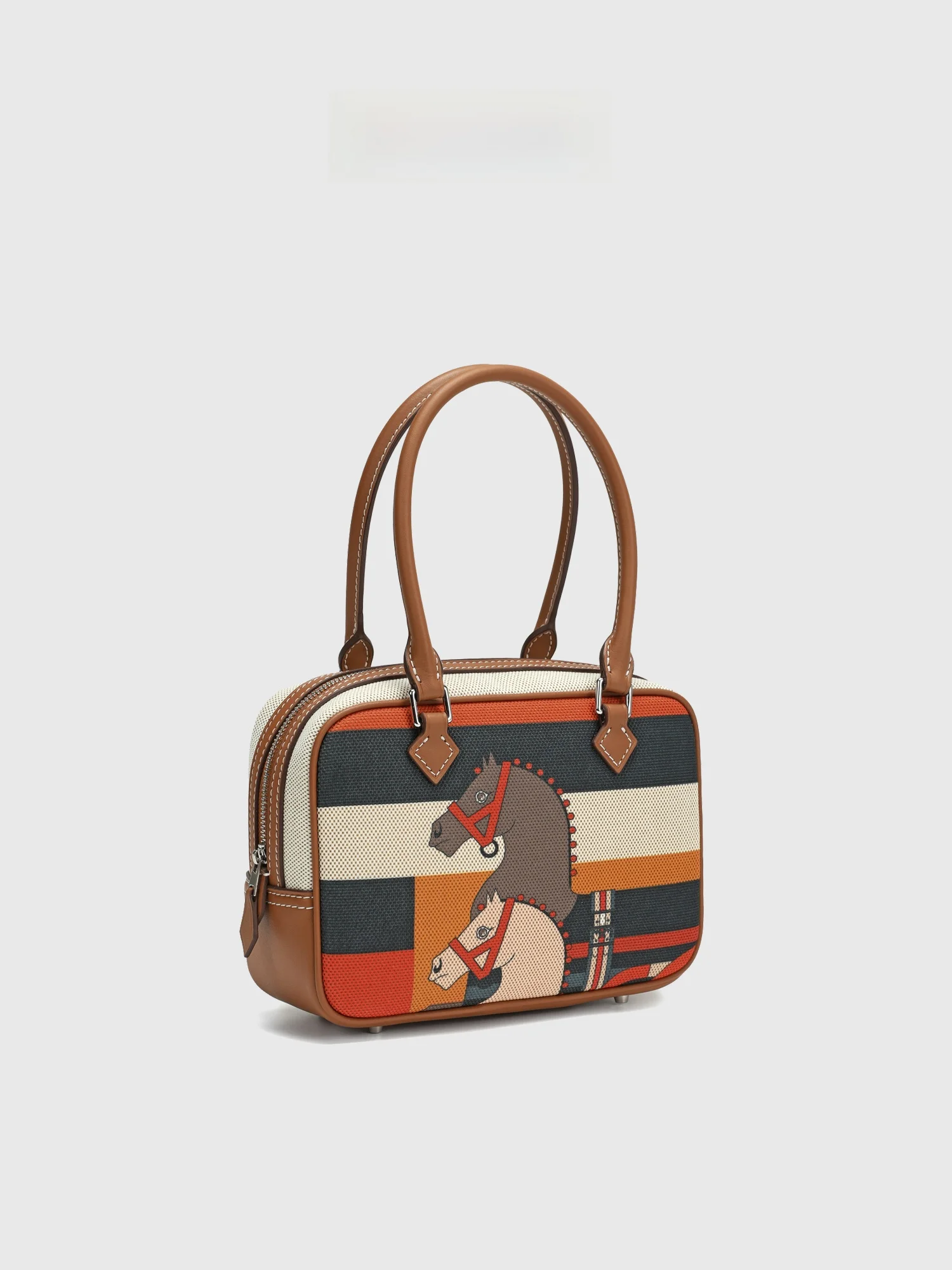 

2026 New Women's Handbag Canvas Feather Splicing Head Layer Cowhide Bowling Bag Versatile Crossbody Print Totem Bag