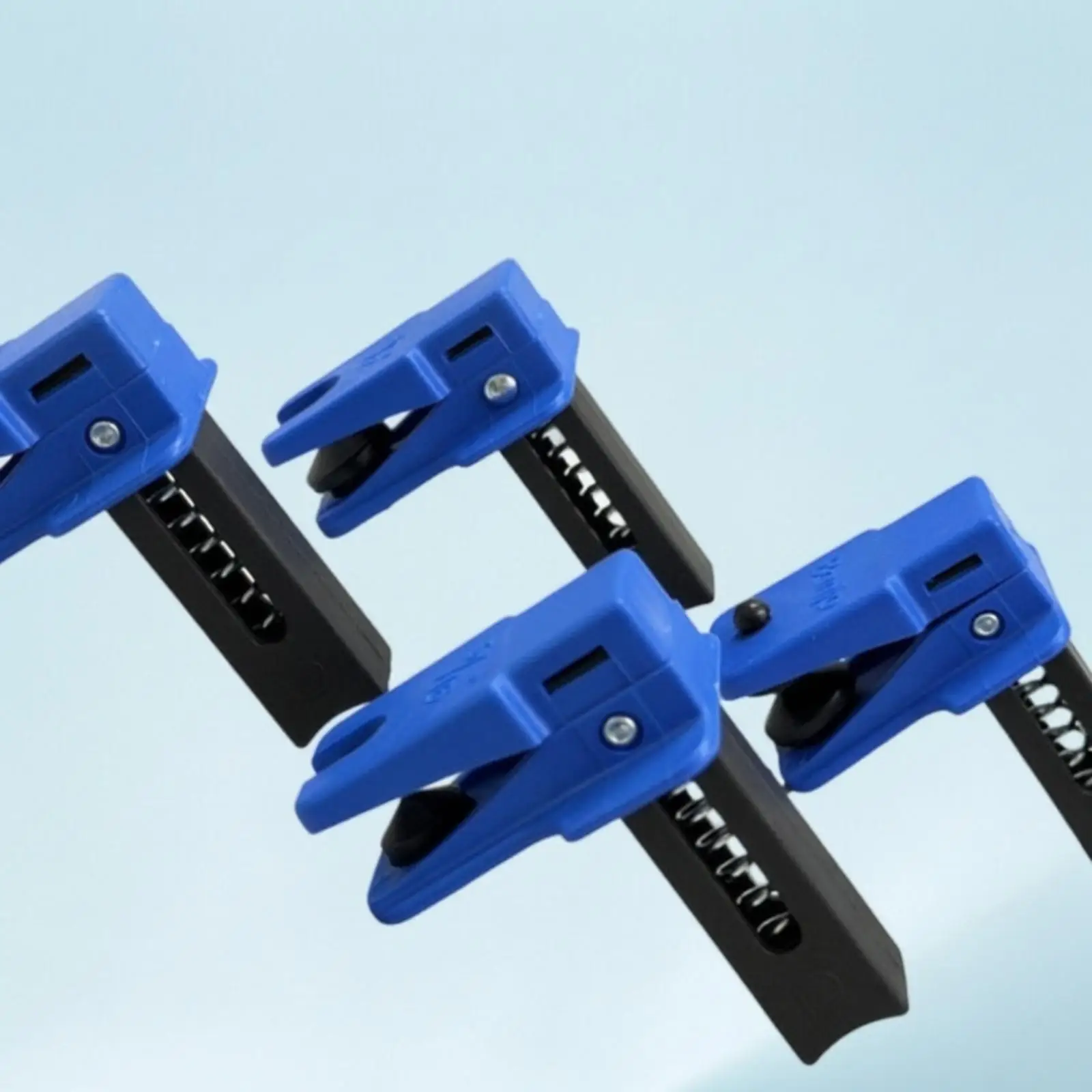 Compact Spring Hinge Brake Hose Clamp for Tight Engine Bay Access in Car Repair Projects