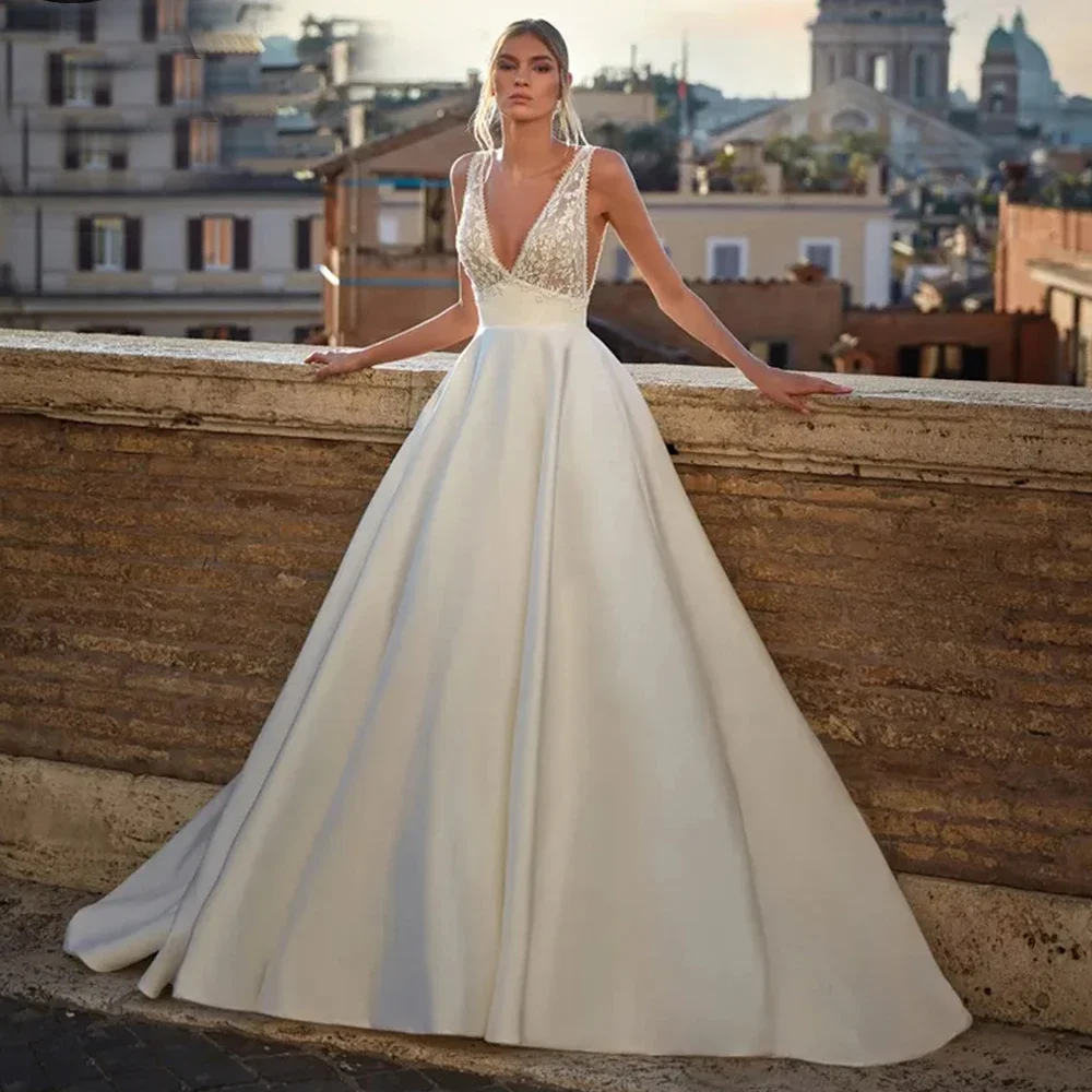 

Customized Princess A Line Wedding Dress Lace Appliqued Sexy Deep V Neck Satin Backless with Pocket Court Train Robe De Mariee