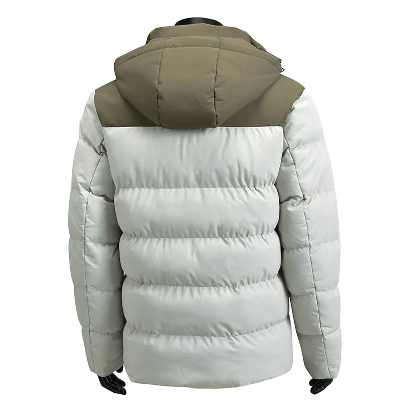 La nueva chaqueta acolchada de algodón con capucha y bloques de color de invierno para hombre es informal y versátil, gruesa, cálida y elegante.