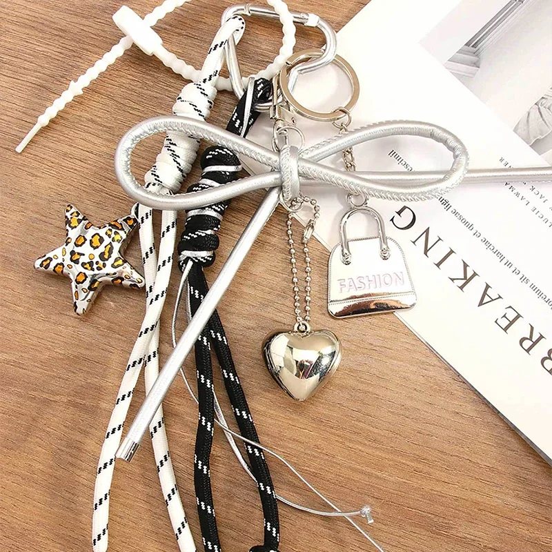 Miu نمط الخماسية نجمة الجلود القوس حقيبة سحر Y2K ليوبارد طباعة مطرز المفاتيح لطيف كيرينغ الإكسسوارات النساء محفظة الحلي