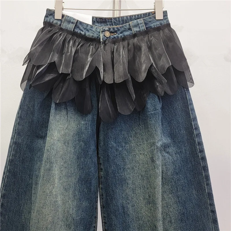 ANJY خريف شتاء جديد إمرأة موضة غير النظامية هيم وهمية قطعتين الجينز العصرية الشارع شيك تنوعا واسعة الساق الدنيم السراويل A16768