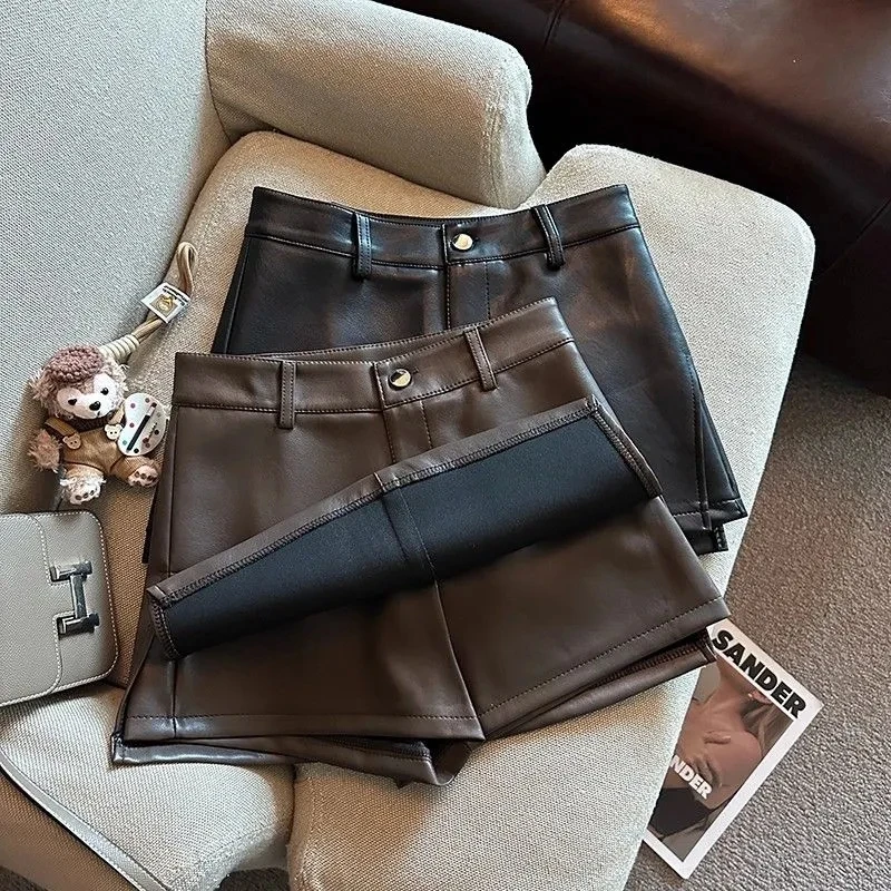 กระโปรงหนัง PU วินเทจทรงเอ สั้น เอวสูง แฟชั่นผู้หญิง สำหรับฤดูใบไม้ร่วงและฤดูหนาว ทรงเข้ารูป สไตล์สตรีทแวร์ รุ่นใหม่