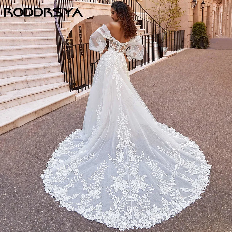 RODDRSYA الشاطئ فساتين الزفاف الدانتيل الأكمام نفخة فساتين الزفاف الأميرة قبالة الكتف Vestido De Novia زين تول سويب تراين شاطئ ثوب زفافيّ شريط رقيق كم عروس ثوب أميرة مكشوف كتف صدرة