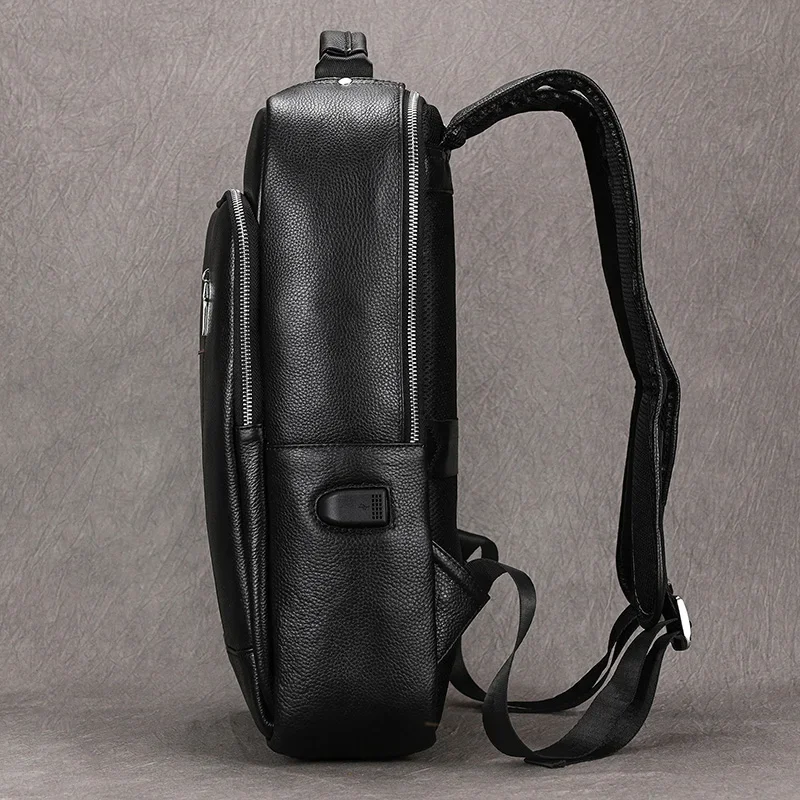 Gran oferta, mochila para ordenador portátil para hombre con carga USB de 15,6 ", mochila impermeable de cuero genuino, bolsas de viaje de moda, mochila escolar, mochila de cuero