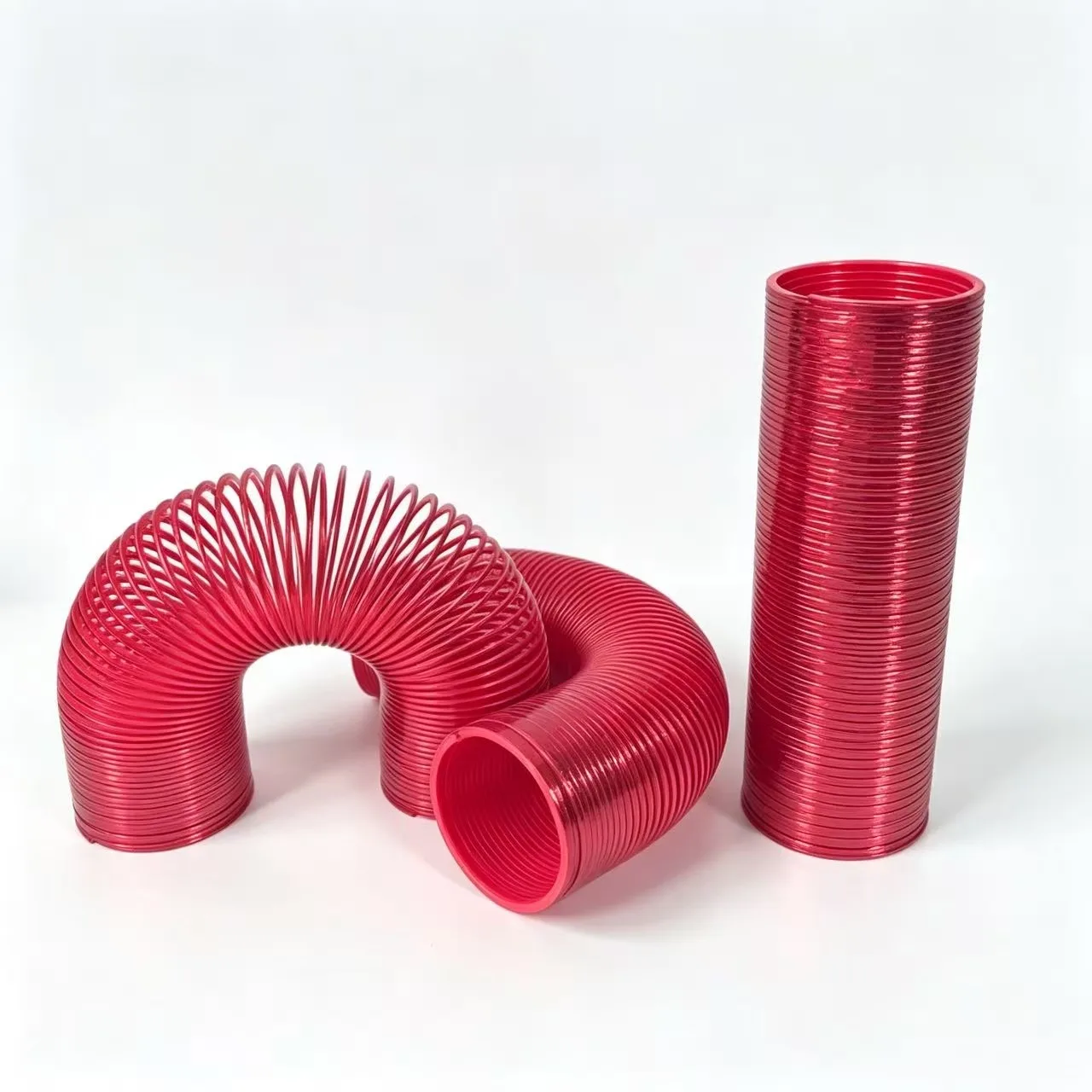 brinquedo-magico-divertido-em-forma-de-circulo-arco-Iris-vermelho-metalico-falso-de-150mm-extra-longo-para-desenvolvimento-precoce-e-educacao-mola-plastica-dobravel-para-criancas