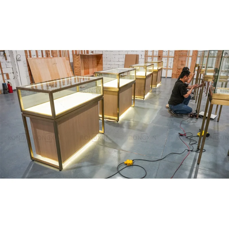 Customized product、Retail Store Jewelry Cabinet Luxury Gold Metal Jewelry Display Showcase LED Light Glass Display Table With Dr